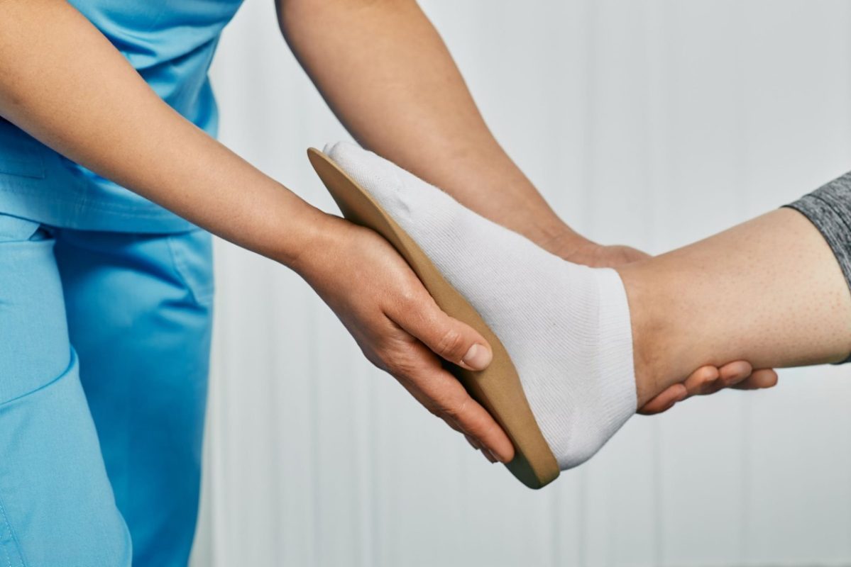 Orthopedist fitting individual orthopedic insole